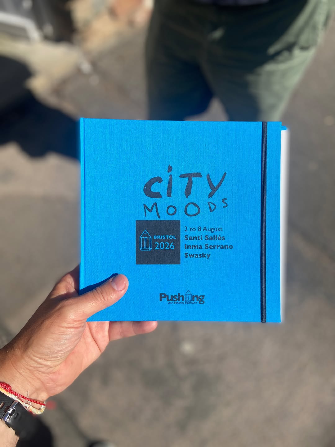 Blue City Moods Bristol 2026 sketchbook held by Swasky